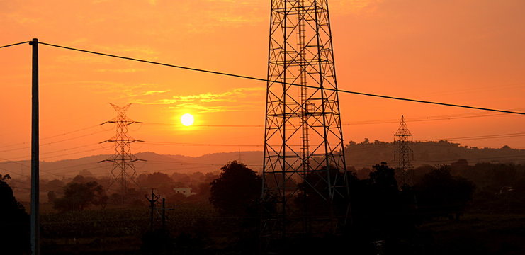 Electricity Pylons At Sunset