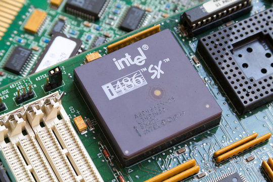 Caklov, Slovakia. 2018/7/28. An Intel i486 SX (80486SX) processor (CPU) from 1989 in a socket on a motherboard.