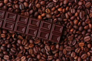 Delicious brown chocolate and coffee beans close up