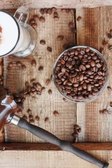 Roasted coffee beans and a cinnamon Dolce latte