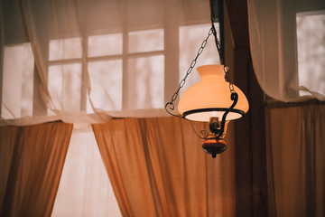 vintage kerosene lamp ,chandelier with large lampshade.vintage style. Retro lampshade hanging with...