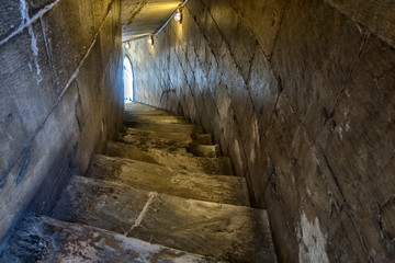 Stone steps. Old staircase leading up towards the light.