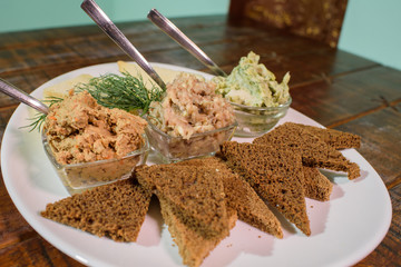 Tasty croutons with formak, liver pate and lard with garlic. Russian appetizer