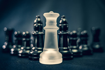 White queen chess piece leading