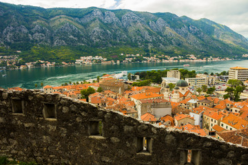 Fototapeta na wymiar Montenegro, Kotor, 09 October, 2019. View of Bas-relief (low relief) on old Kotor walls of the old town and ancient walls of Kotor Fort (St John Fortress) and Chapel of Our Lady of Salvation