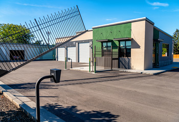 Gate at a mini storage warehouse location opening
