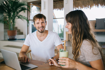 Happy successfully couple working from home together