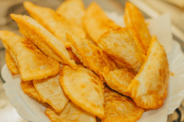 frying homemade pastries at home, brazilian cultural salty food