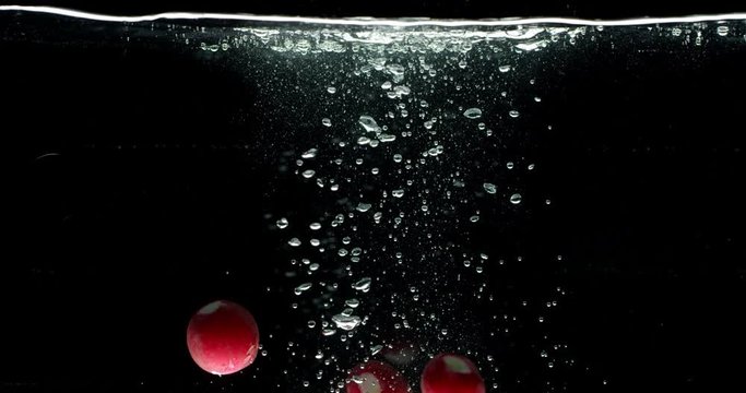 Radish fall into water isolated, slow motion, shot on Red Weapon Helium, bubbles in water, splashes, Laowa Probe Macro 24mm lens