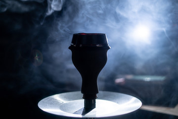 the hookah place with lots of smoke in the dark room