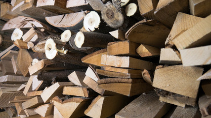 Wooden logs, beams, firewood, frame. Wooden log wooden background. Pile of firewood. 