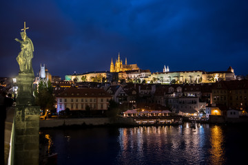 Fototapeta na wymiar Illuminated Saint Vitus Cathedral, Hradcany Castle And River Moldova In The Night In Prague In The Czech Republic