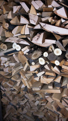 Wooden logs, beams, firewood, frame.Detail of logs stacked for firewood. Background of dry chopped firewood logs in a pile. Harvesting firewood for the winter.