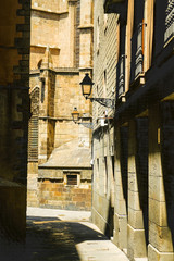 Fototapeta na wymiar Barcelona. Narrow medieval street in gothic quarter. Catalonia, Spain.