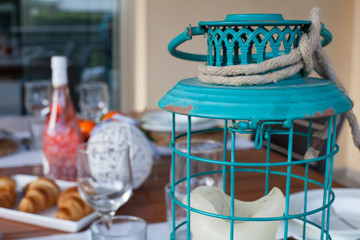 candle in a cage on the table