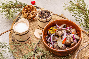 Pickled (fermented) mushrooms. Traditional New Year (Christmas) snack. Festive table cutlery setting