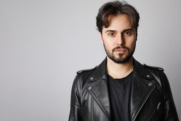 Obraz premium Young bearded hipster posing on the white background. Isolated