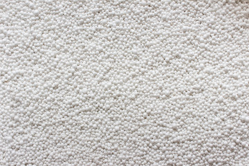Closeup of expanded polystyrene bubbles particles spheres. Polymeric particle used to fill bag chairs.