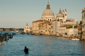 Naklejka premium Grand Canal in Venice, Italy with single Gondola and domed church in background