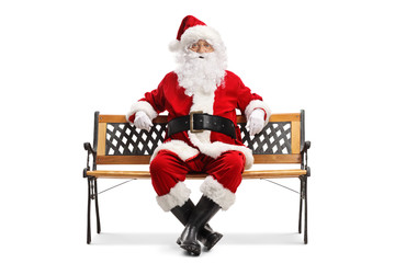 Santa Claus resting on a bench