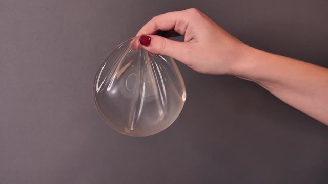 Silicone breast implant surgery gel type and smooth surface demonstration