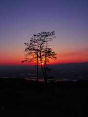 Sunset on mountains is a beautiful silhouette background.