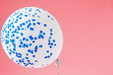 Festive pink background. Shining stars and balloon on light pink pastel background. Christmas. Wedding. Birthday. Happy woman's day. Mothers Day. Valentine's Day. Flat lay, copy space.