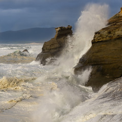 Waves crashing against rocks at Cape Kiwanda State Natural Area near Pacific City, Oregon.