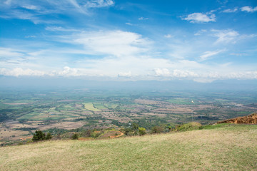landscape with green field and blue sky