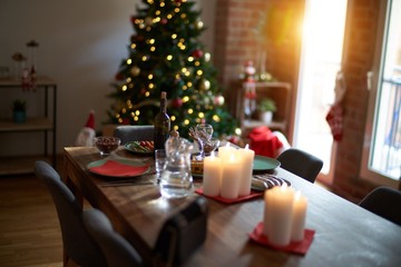 Nice home with tree, decorations and table with food prepared to celebrate Christmas.