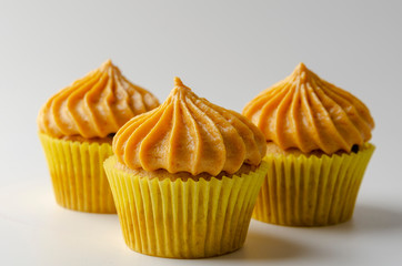 Pumpkin cupcakes with pumpkin-caramel cream Isolated on a White Background
