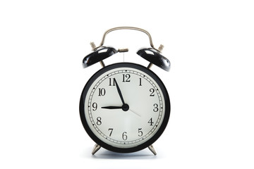 black vintage alarm clock on white background