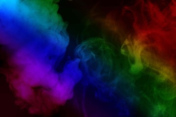 Fototapeta na wymiar Abstract colorful smoke isolated on black background,Rainbow powder
