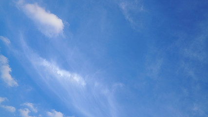 White cloud and blue sky background with copy space