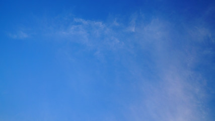 White cloud and blue sky background with copy space