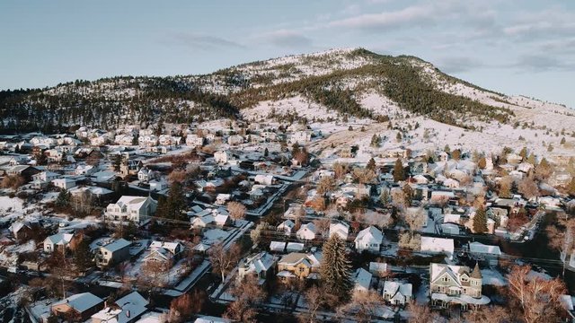 Helena, Montana on a cold winter morning at sunrise with a beautiful neighborhood and the mountains.