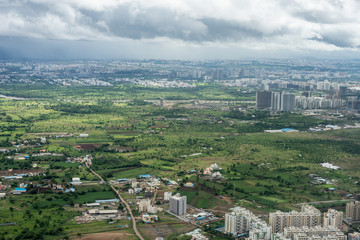 Bangalore to Pune, , a view of a city with a mountain in the background