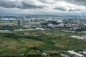 Bangalore to Pune, , a large green field with trees in the background