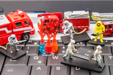 Firefighters and rescue teams on keyboard computer laptop.Computer equipment.Computer repair concept.