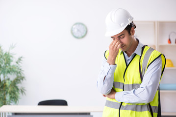 Young male architect working in the office