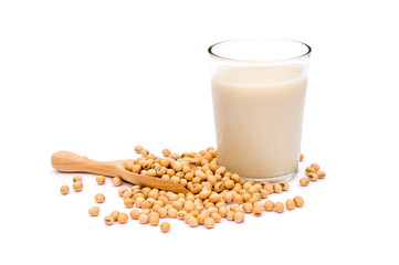 Soybeans in wooden scoop and glass of soy milk isolated on white background. Healthy drinks concept.