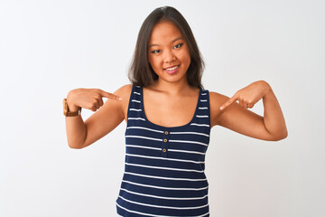 Young chinese woman wearing striped t-shirt standing over isolated white background looking...