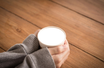 Coffee espresso on wood table nature background in garden,warm tone,Isolate white drink cup.