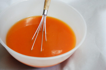 Cold handmade soap that stirs in the bowl.