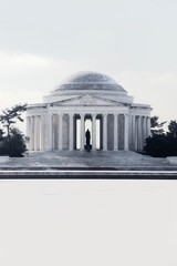 Jefferson Memorial in front of a frozen tidal basin on a winter day in Washington DC - 301670644