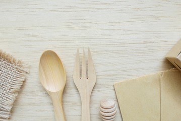 Wooden spoon, fork, cup on cement background, Zero waste Concept