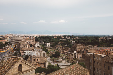 Fototapeta na wymiar Panoramic view of city Rome with Roman forum and Colosseum from Vittoriano