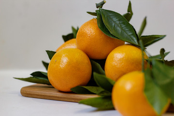 fresh tangerines with green leaves