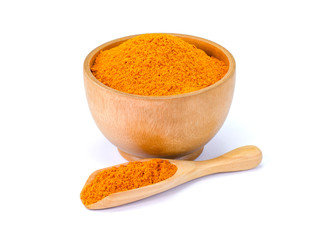 Turmeric or tumeric powder ( known as curcumin, Curcuma longa Linn) in wooden bowl and spoon...