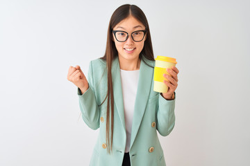 Young chinese woman wearing glasses drinking coffe over isolated white background screaming proud and celebrating victory and success very excited, cheering emotion